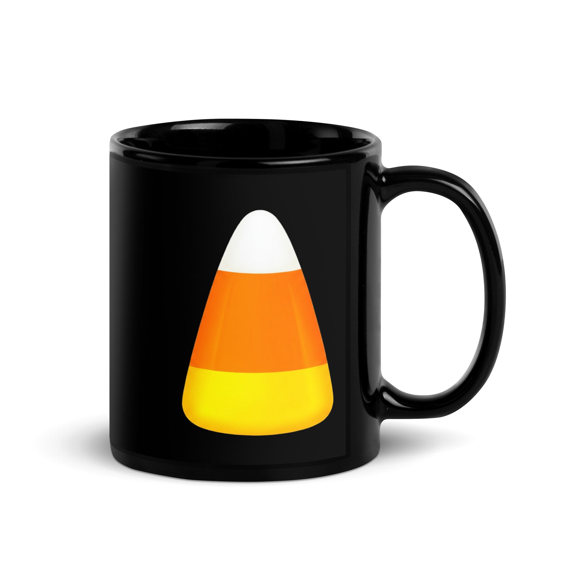 Black ceramic mug featuring a printed candy corn graphic with white, orange, and yellow stripes