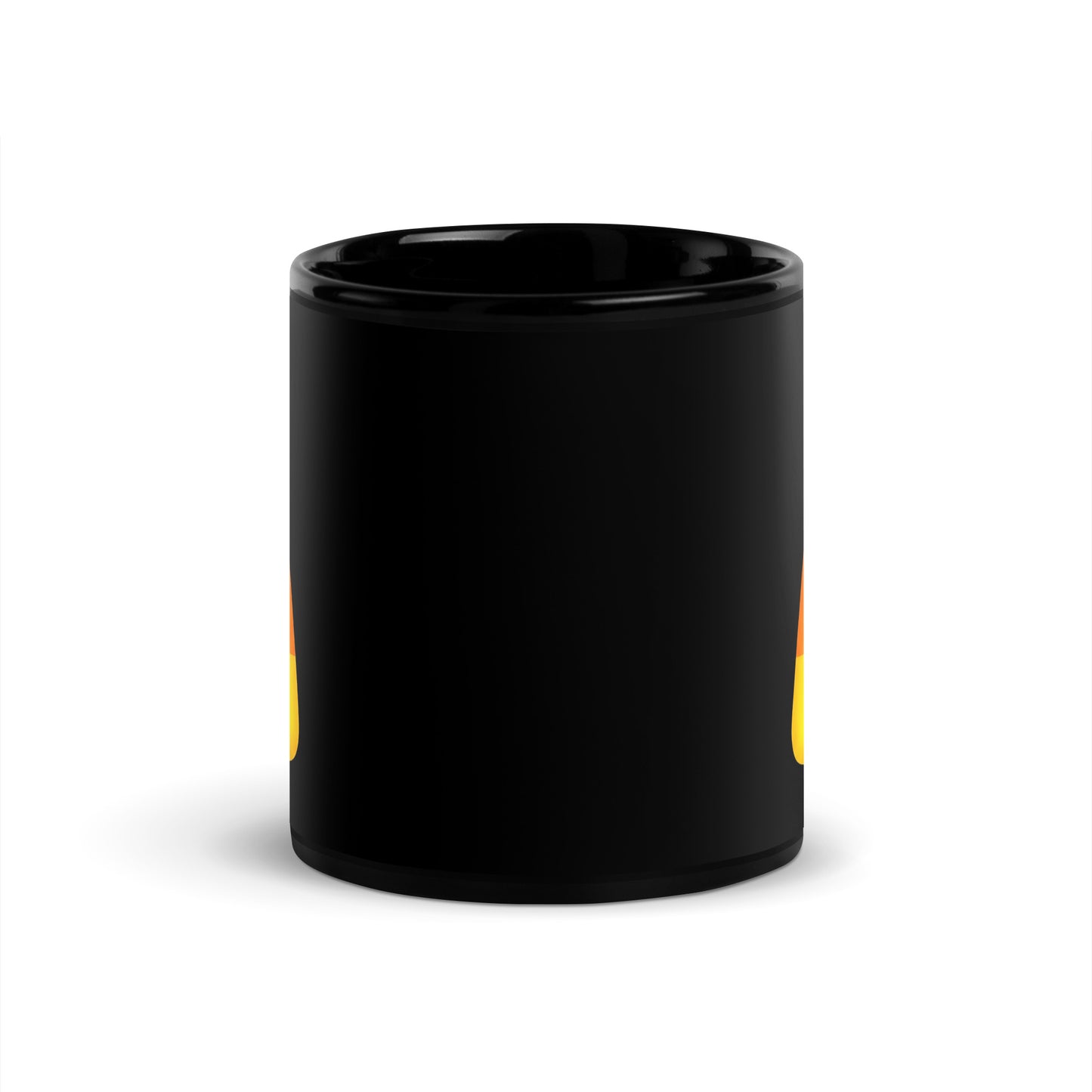Black ceramic mug with a candy corn design visible on the sides
