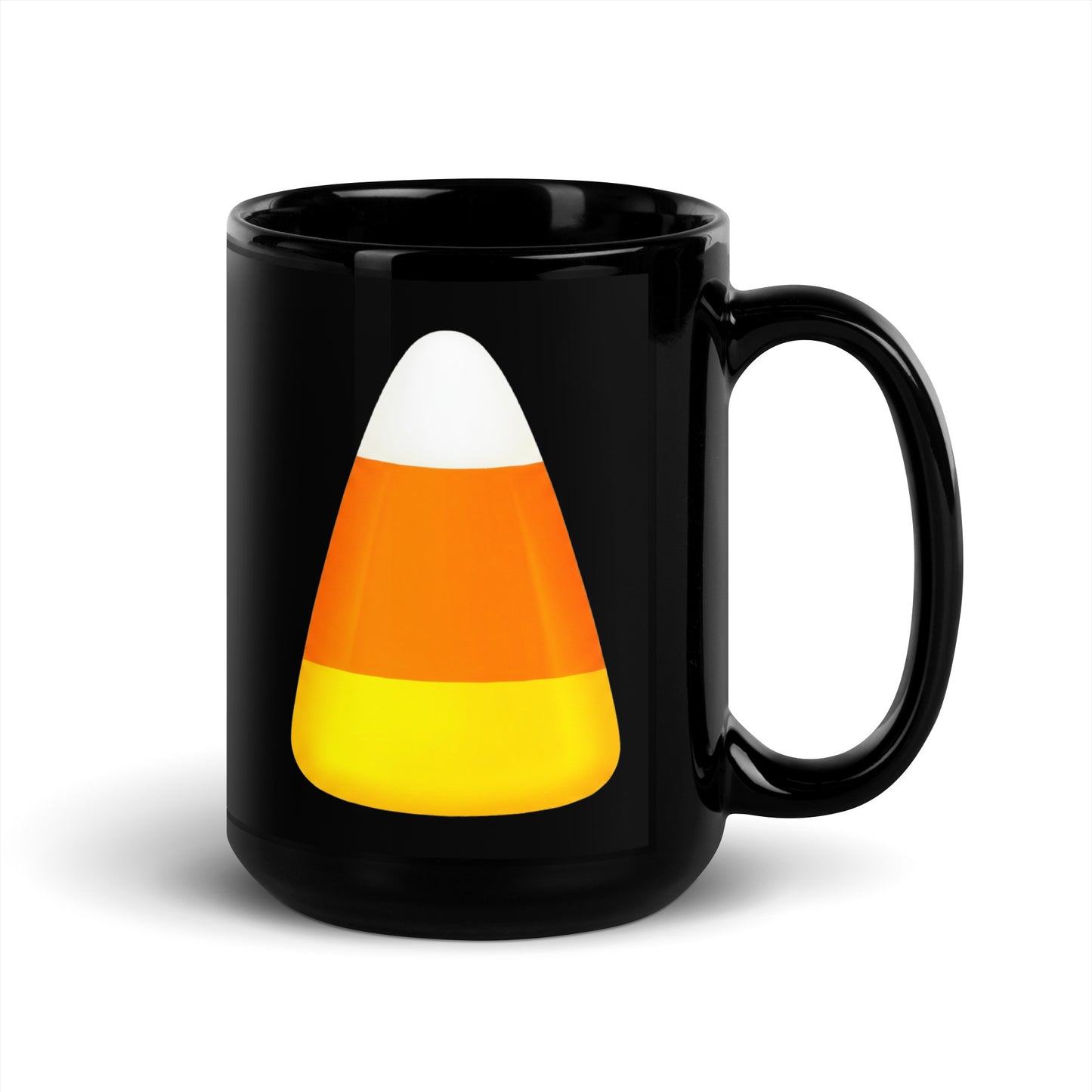 Black ceramic Halloween mug featuring a printed candy corn graphic with white, orange, and yellow stripes