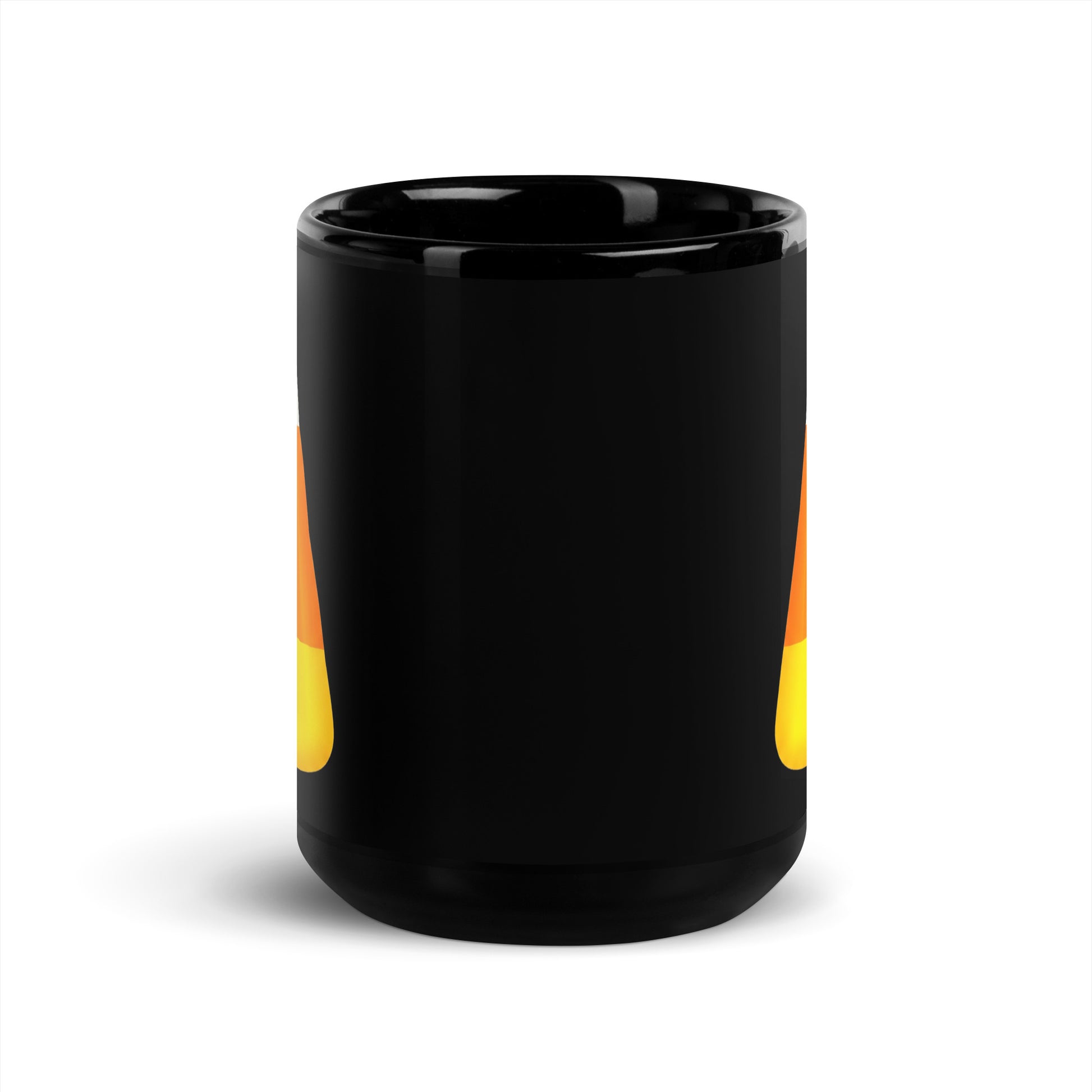 A glossy black trick or treat ceramic mug with a design of orange and yellow candy corn visible on the sides