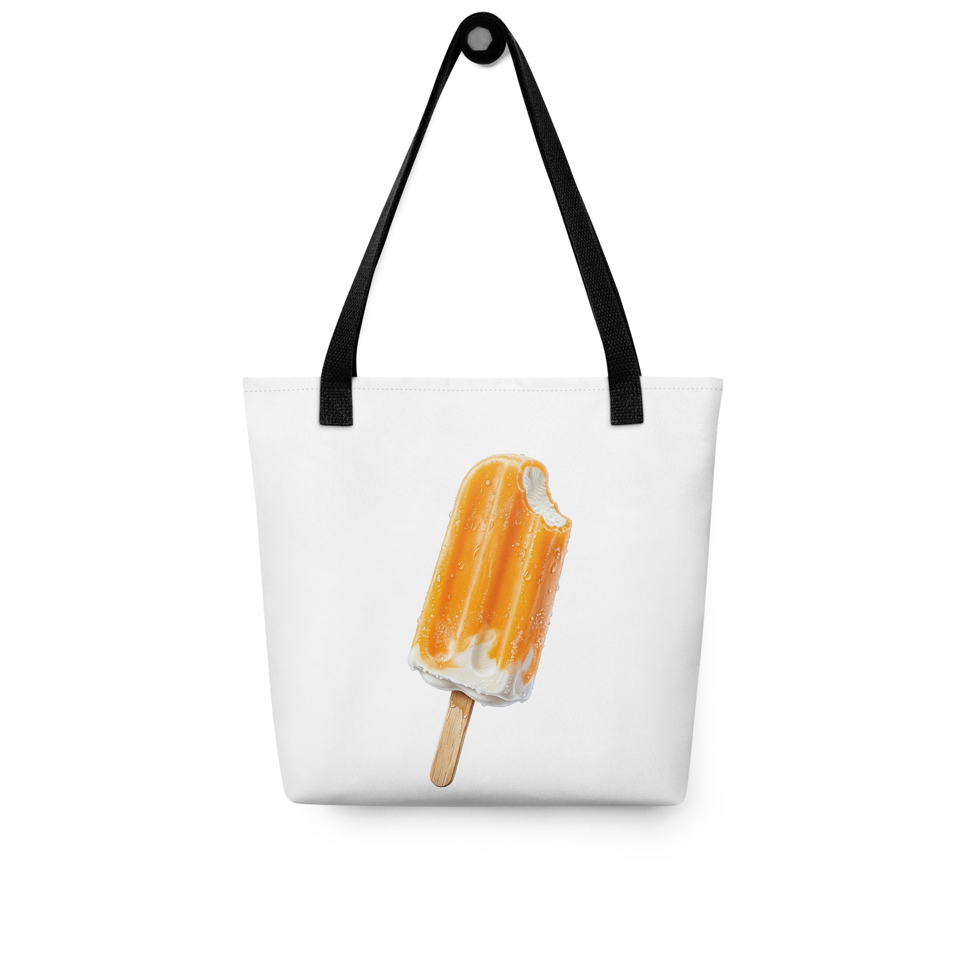 A white tote bag with black shoulder straps, featuring a printed illustration of an orange cream popsicle