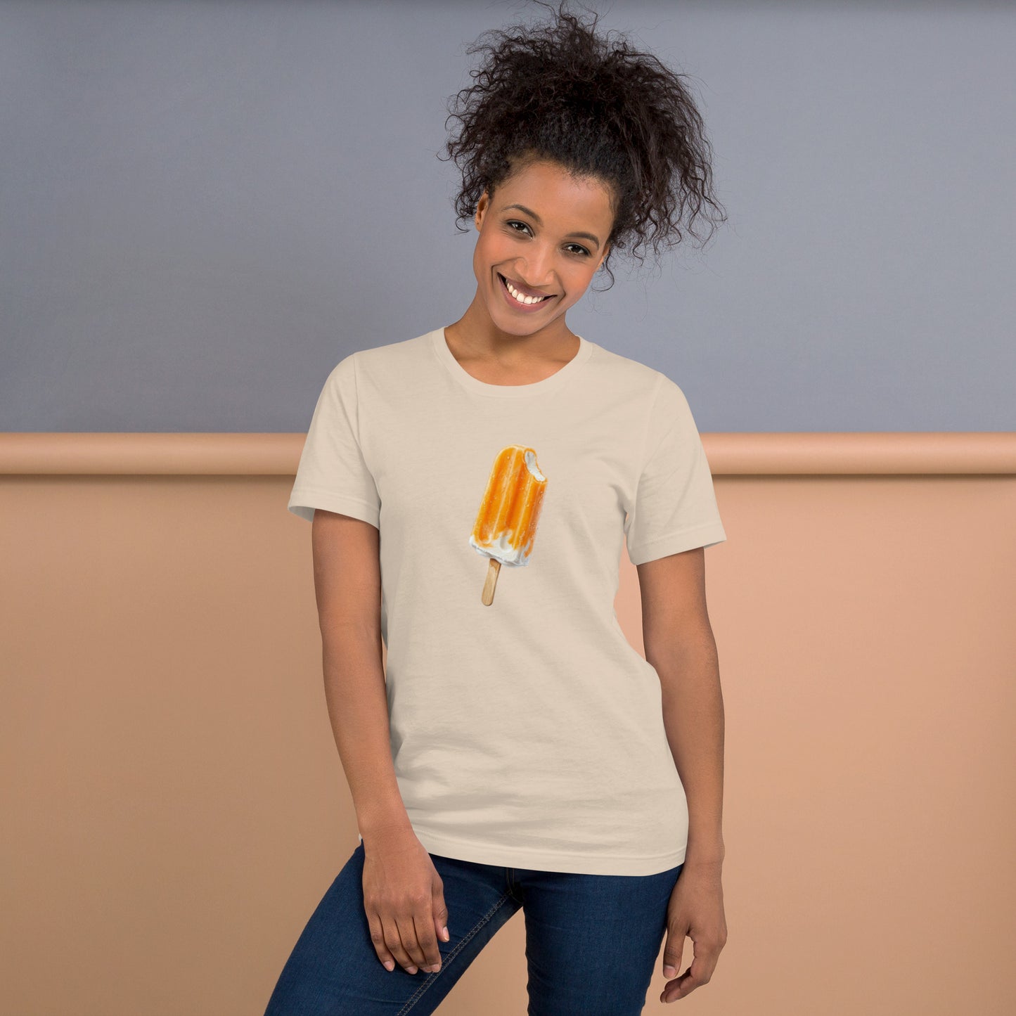 Woman's soft cream t-shirt with an orange cream popsicle