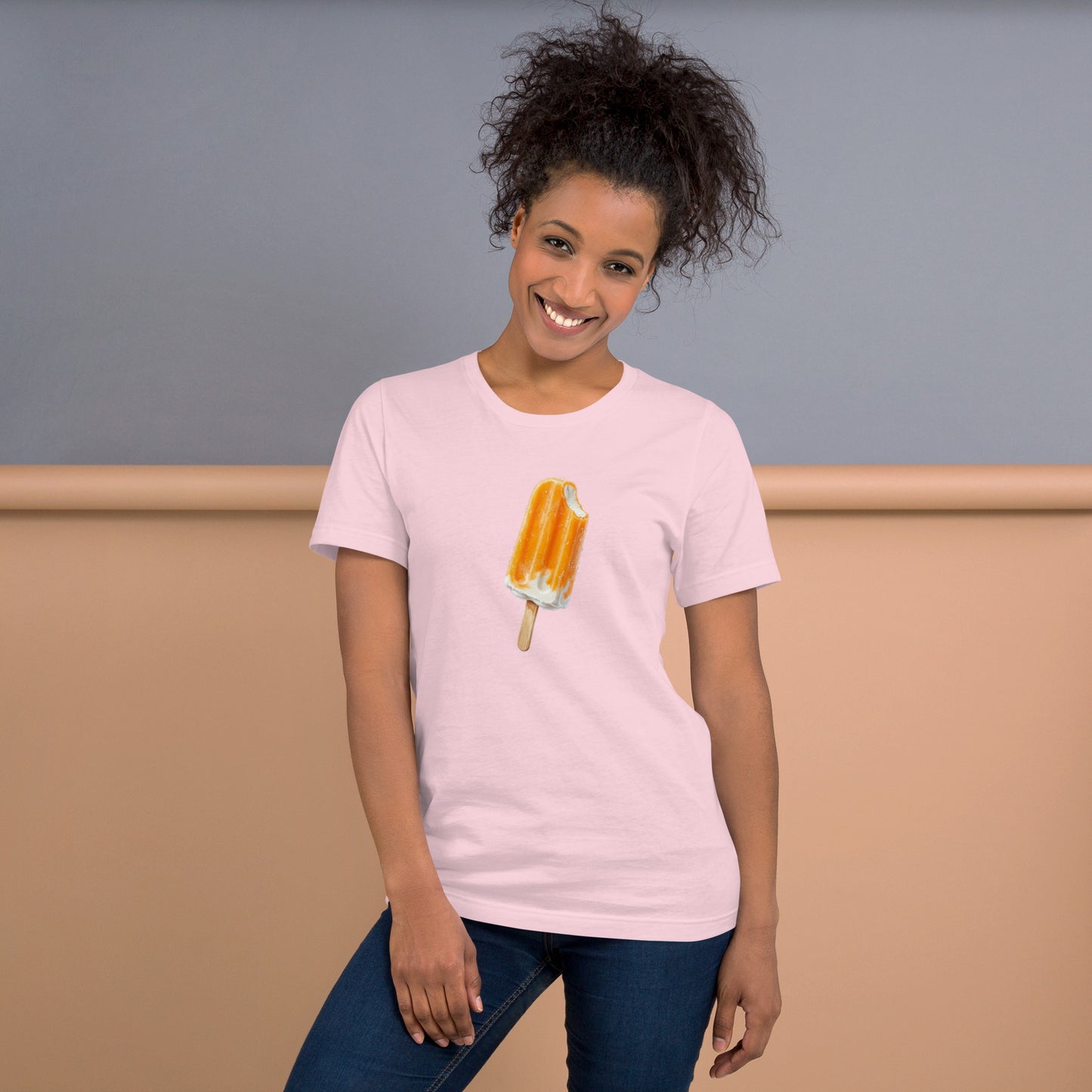 Woman's soft light pink t-shirt with an orange cream popsicle 