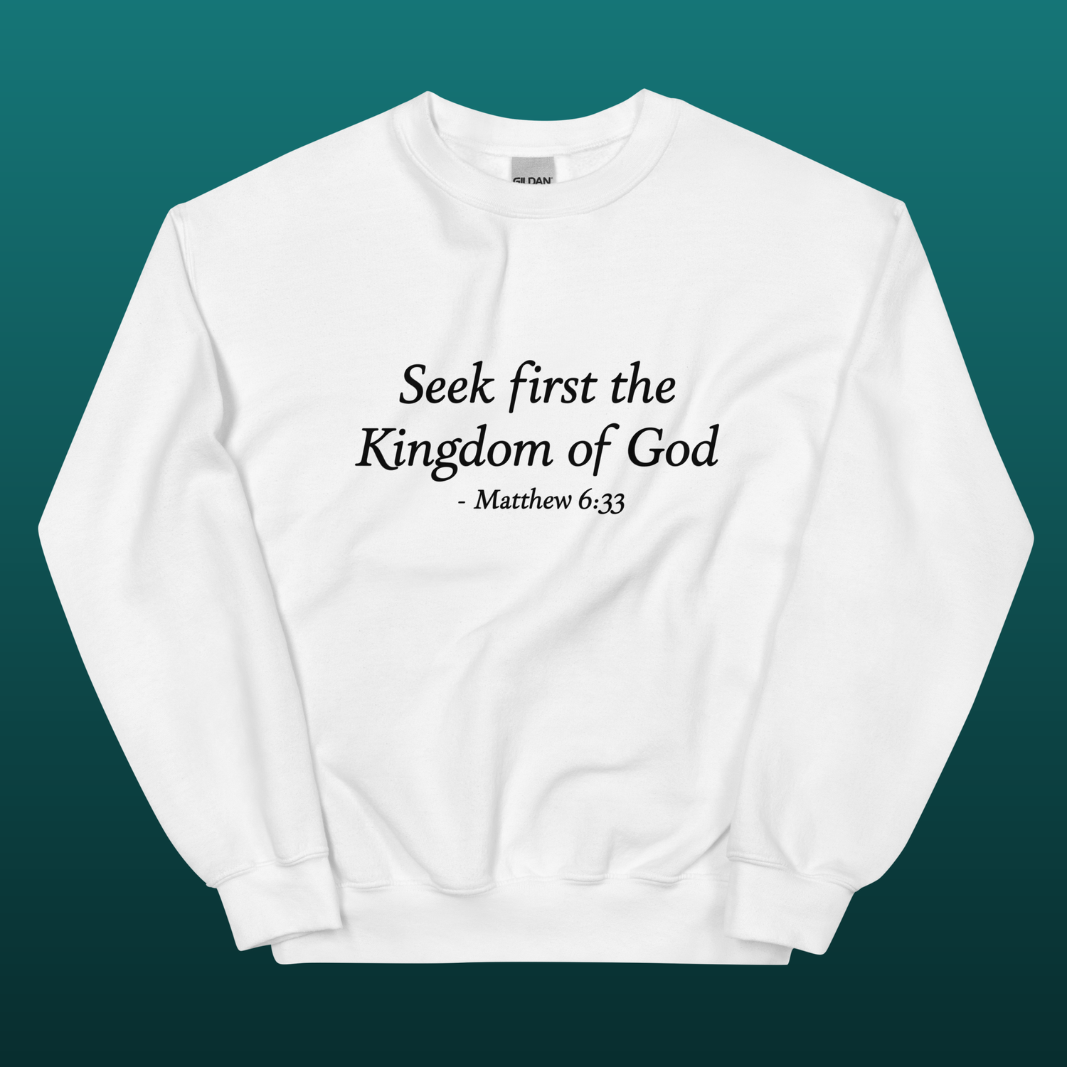 White sweatshirt with text 'Seek first the Kingdom of God - Matthew 6:33' mockup