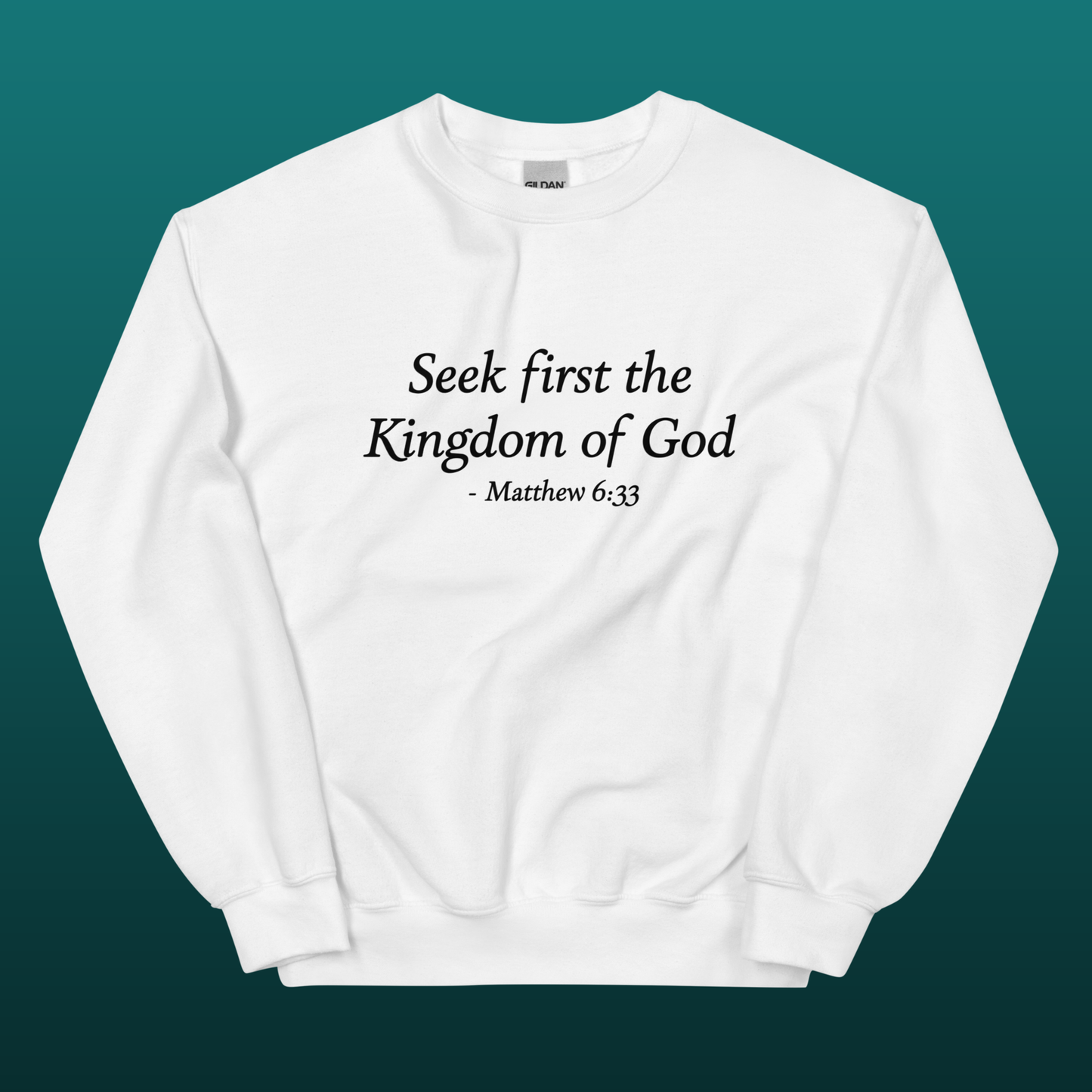 White sweatshirt with text 'Seek first the Kingdom of God - Matthew 6:33', mockup